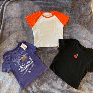 3 NWT Women Crop Top Graphic Tees Size M & S Orange Black Purple Short Sleeves